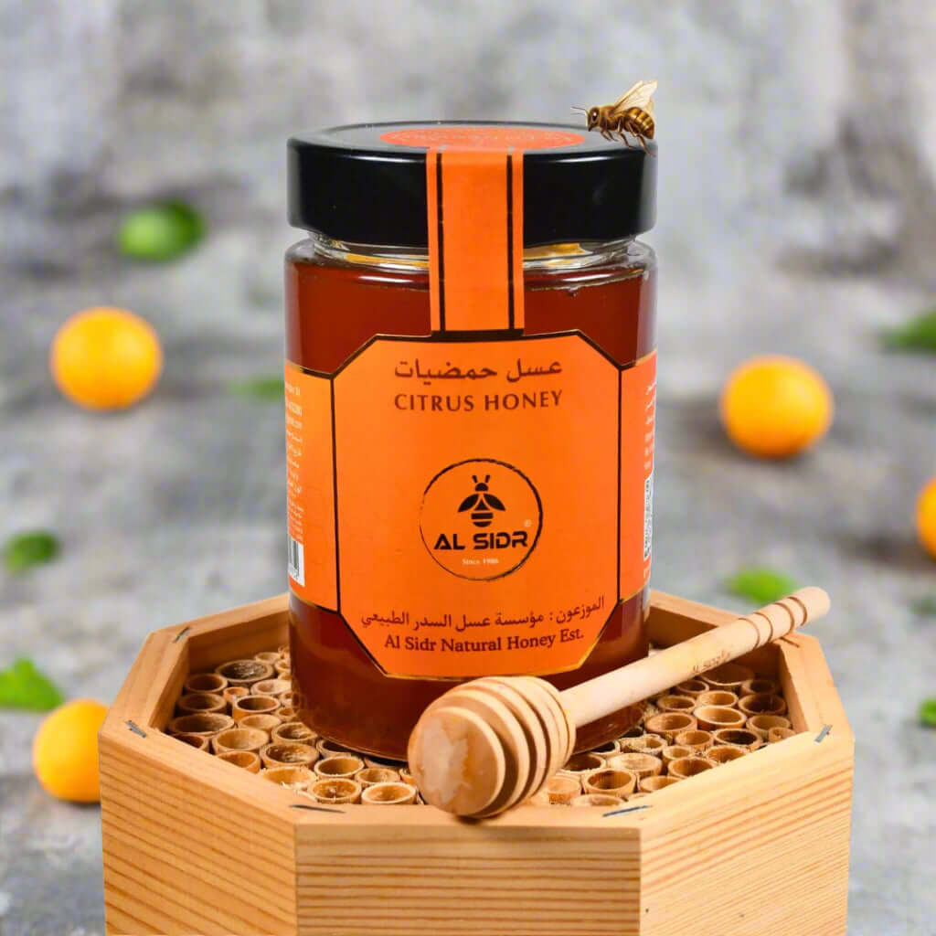 Organic citrus honey from Al Sidr, 500g jar with honey dipper, natural and healthy, unique flavor from UAE.