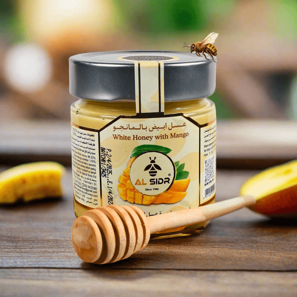 Organic mango honey 250g by Al Sidr, pure white honey with tropical flavors, perfect for healthy breakfasts in UAE.